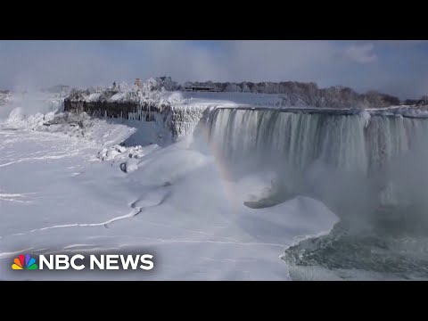 Partially frozen Niagara Falls attracts tourists in below freezing temperatures