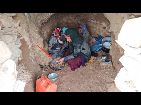 Making pollen bread with charcoal in torrential rain by a displaced mother in a shelter