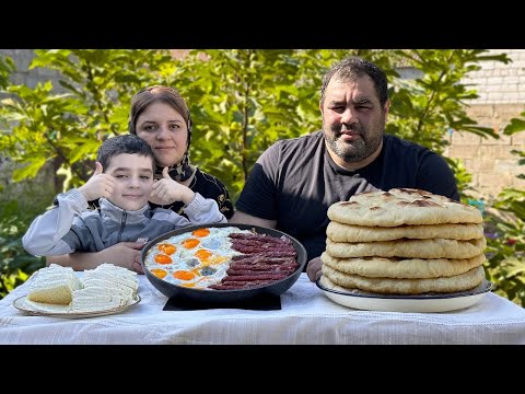 Breakfast of nomads from the Far East  Scrambled eggs with sausages