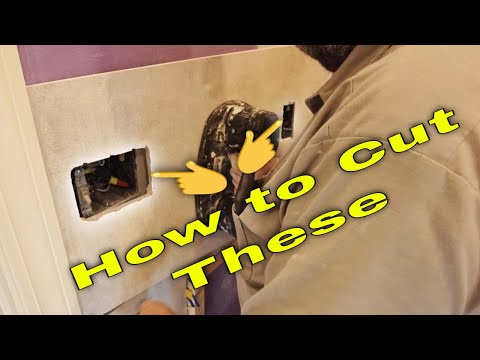 Cutting holes for electrical outlets in huge tile.