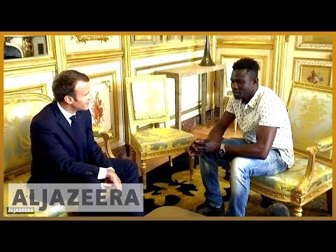 🇫🇷 'Spider-Man' of Paris rescues dangling child | Al Jazeera English