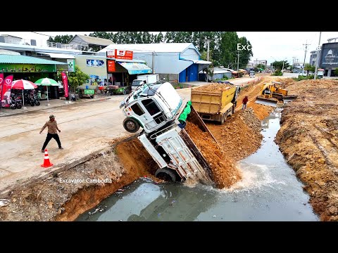 Be Careful !! Dump Truck Drive Back Unloading Soil Overturned And Recovery By Expert 12 Wheel Crane
