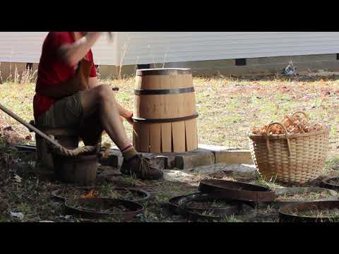 Coopering a gunpowder barrel. Trussing the barrel.