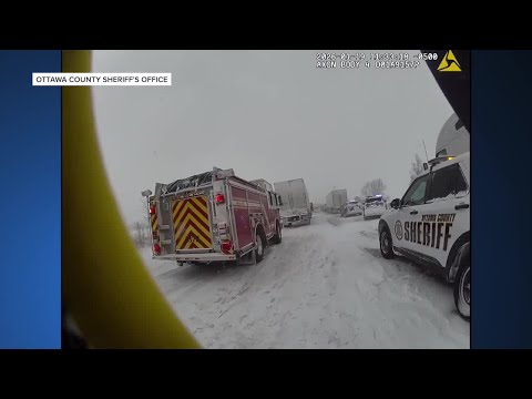 Body camera video shows aftermath of 100-vehicle pileup on I-196 in Hudsonville