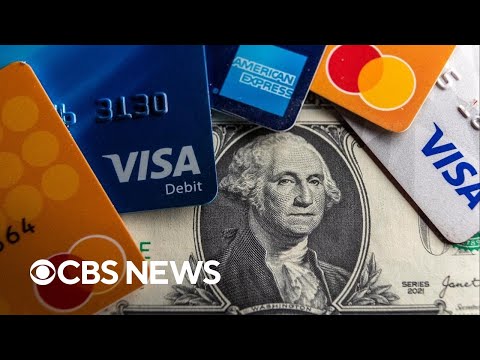 Record number of Americans carrying credit card debt they can't pay off, report shows