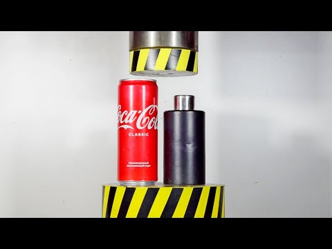 A hydraulic press compresses objects in a cylinder.