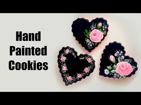 Hand painted roses on black heart cookies