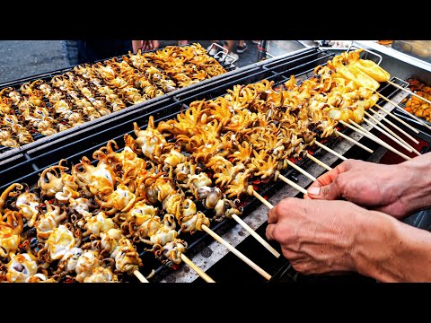 A collection of night market restaurants selling food on carts | Thai Foods