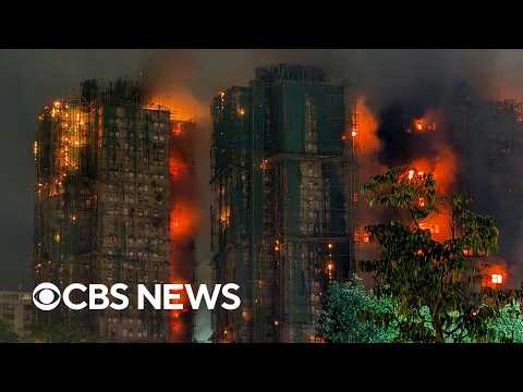 Videos show fire engulfing Hong Kong housing complex