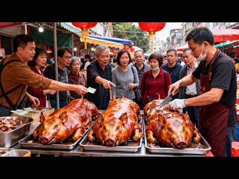 A bustling market in Foshan, Guangdong, China, is a popular spot for crispy roasted pork. Fresh c...