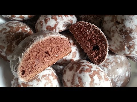 Chocolate gingerbread cookies in sugar glaze.
