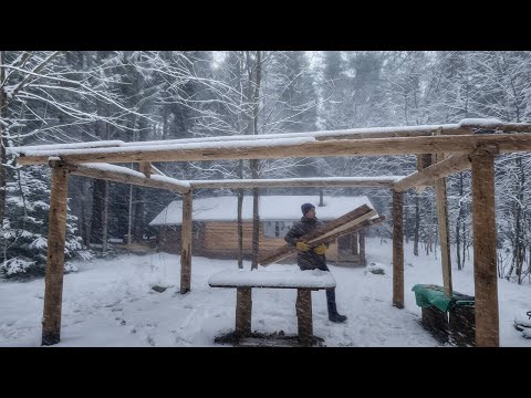 The log cabin and the taiga are covered with snow - Hugo and I spent 24 hours in the forest