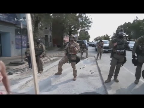 Tensions rise in Chicago after officers fired at a woman who allegedly rammed her car into officers