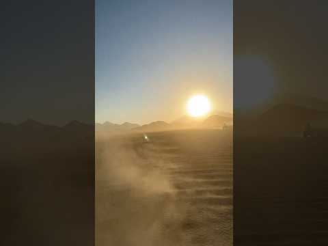 Riding Through the Desert at Sunset
