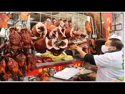 冬至节日 冬大过年 店外大排长龙 师傅斩不停手 卖了六十隻烧猪 烧乳猪烧猪烧腩骨烧鸭烧鹅很抢手 玫瑰露酒油鷄 叉烧 滷水乳鸽 新强记烧腊饭店佐敦