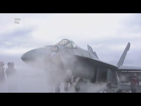 U.S. Navy fighter jet rolls off carrier, falls into ocean