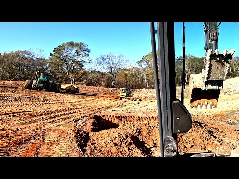 Installing a pond dam core on the largest pond we have ever built. Part 1.