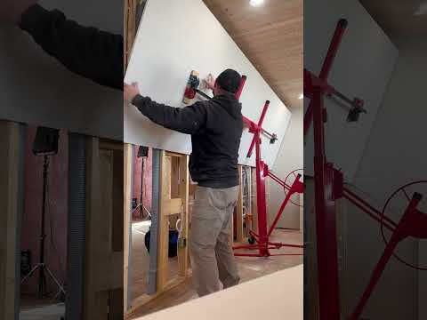 Hanging drywall sheets the easy way #shorts  #diy #home #carpentry