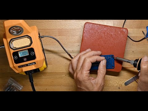 C.K. tries a soldering iron from Wisehigh powered by a Dewalt tool battery