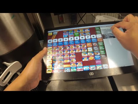 McDonalds POV lunch rush taking orders at Drive-Tru