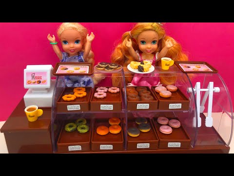 Elsa and Anna toddlers surprise at the donut shop