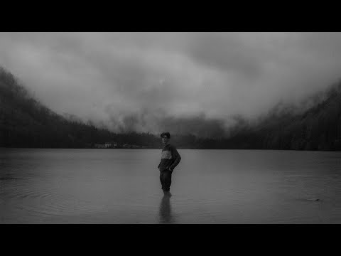 Self portraits in the rain at a lake.