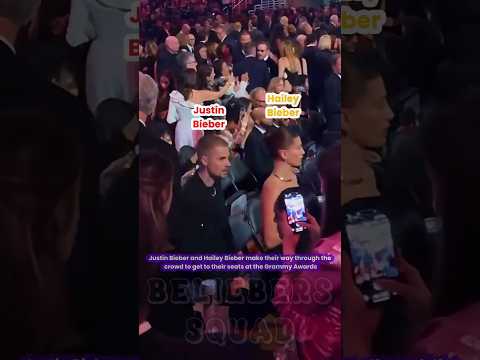Justin Bieber and Hailey Bieber make their way through the crowd to get to their seats #justinbieber