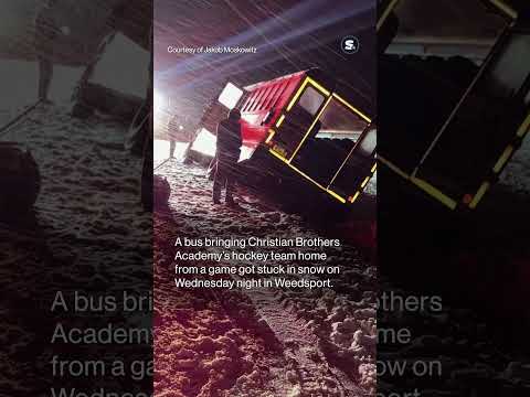 School bus bringing CNY hockey team home from game goes off road, gets stuck in snow