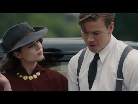 Will Poulter and Lucy Boynton sharing a cigarette