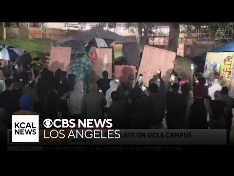 Chaos on the UCLA campus as protestors break down the walls of pro-Palestine encampment