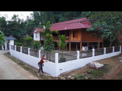 Install decorative ironwork for the fence and paint the wall - Building a fence house for Neighbors