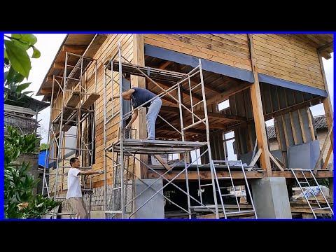 Skilled craftsmen build beautiful wooden houses in the countryside