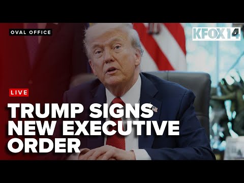 President Donald Trump signs a new executive order from the oval office