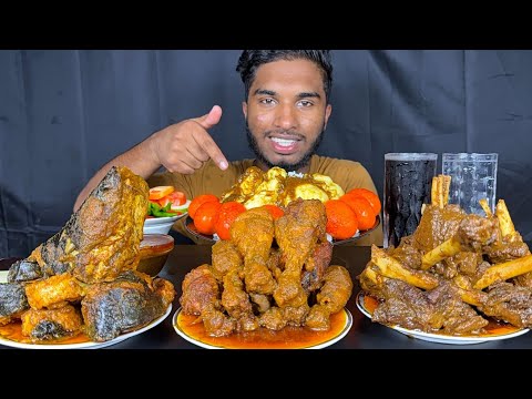 spicy mutton curry, chicken leg piece curry, fish curry, egg curry and mutton fat with rice eating