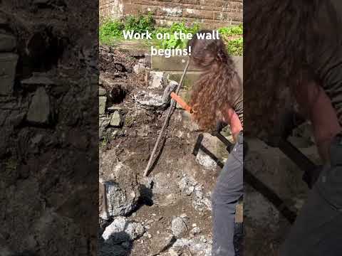 Work on the stone wall begins!