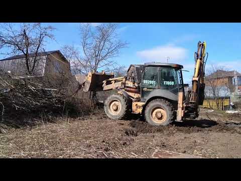 Stump removal and site leveling with a tractor