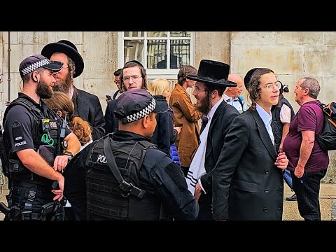 POLICE INTERVENE as group DISRESPECT The King's Guard at Horse Guards!