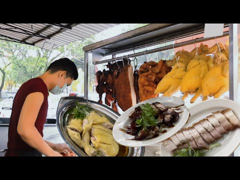 吉隆坡甲洞一家海南鸡饭，由甘榜鸡制作，香滑多汁，雞嫩飯香，真是吃了还想再吃……