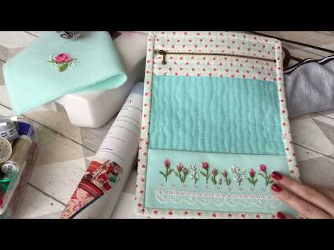 Cross-stitch project bag with a clear window and embroidered zipper