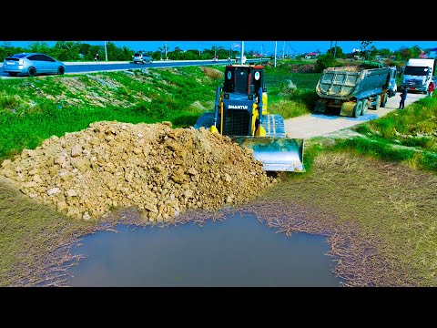 Nice skill pushing!! Bulldozer starts new project landfill pushing soil with dump trucks