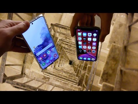 Dropping Samsung Galaxy S20 vs iPhone 11 Pro Down Spiral Staircase - 200 Feet - Will It Survive?