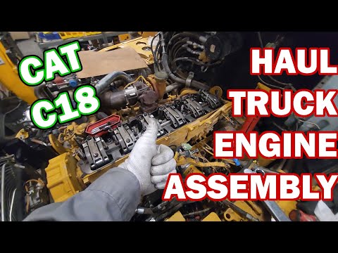 Putting the Cat 18L Engine back together in a Big Haul Truck. Cat C18 Diesel Engine.