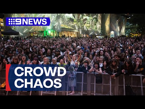 Free concert cancelled after fans smash through barriers | 9 News Australia