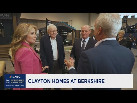 Kevin Clayton on the floor with Warren Buffett and Greg Abel at Berkshire Hathaway annual meeting