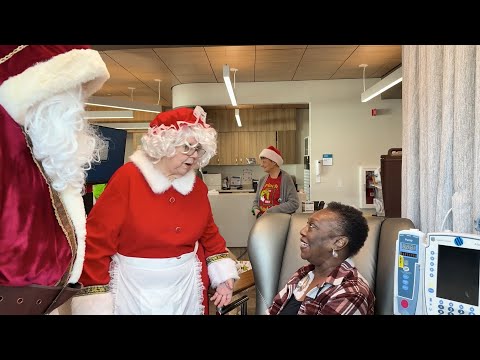 Hospital workers visit patients dressed as Santa, Mrs. Claus, The Grinch and Max!