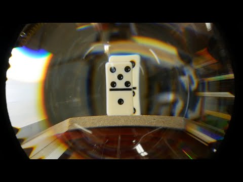 Hypercentric optics: A camera lens that can see behind objects