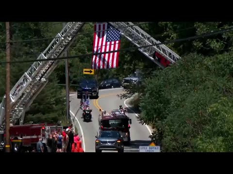 Firefighter killed at Trump rally honored with bagpipes, gun salute and a bugle sounding taps