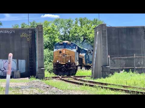 Trains Cross RR Diamond & Pass Thru Flood Wall!  Train & Truck Meet On Giant Bridge Over RR Yard