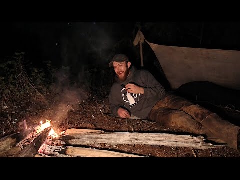 Backcountry Bedroll Camp Next To Forest Creek