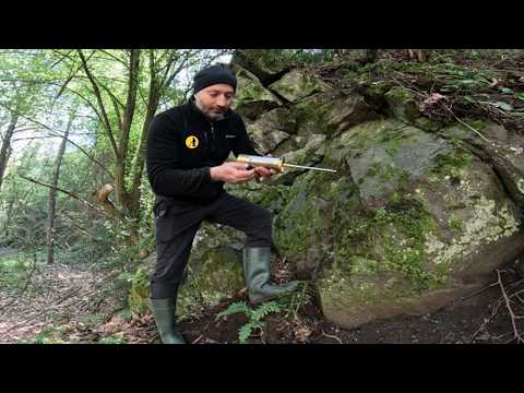 I'm opening the treasure chest hidden in a trap under the big rocks